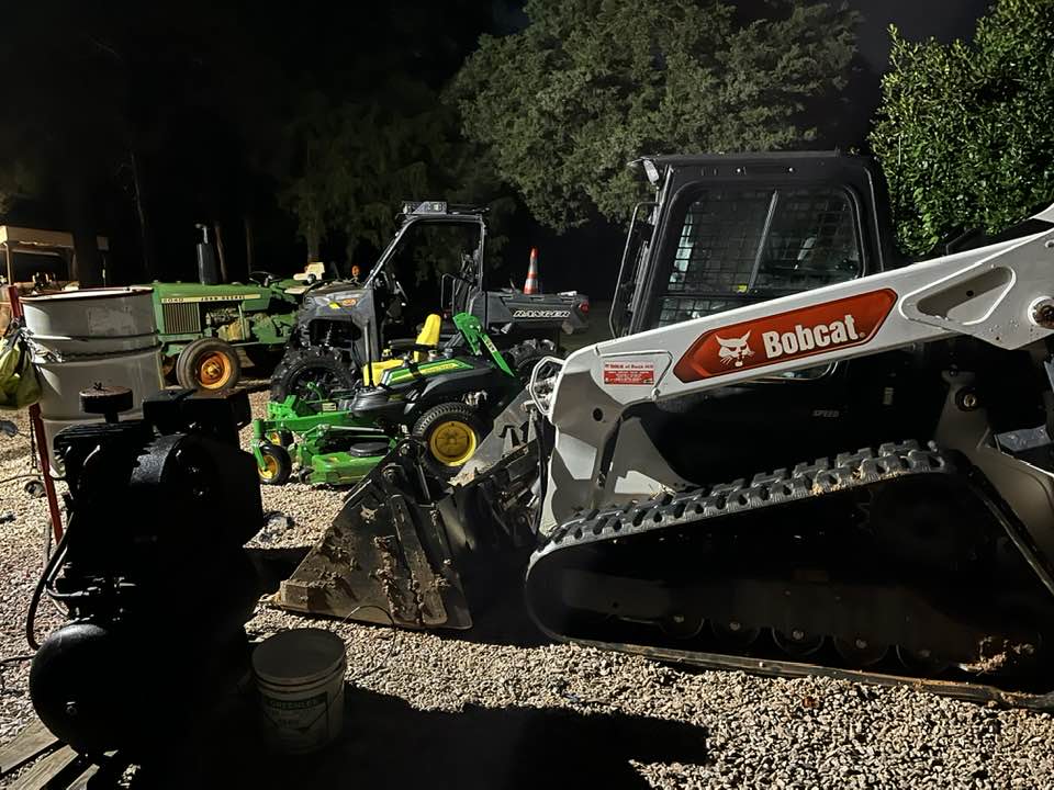 Bobcat skid steer with John Deere equipment fleet